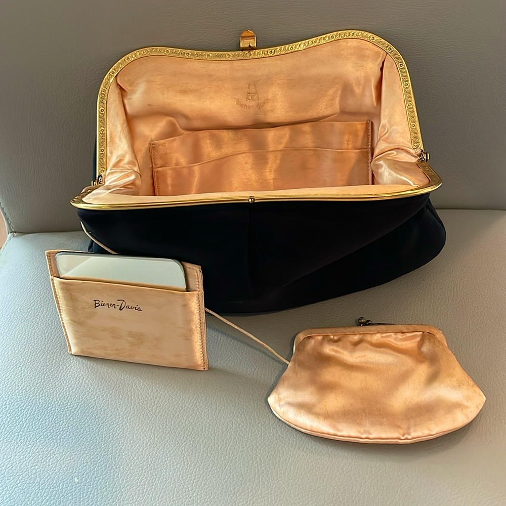 Black clutch with gold tone trim